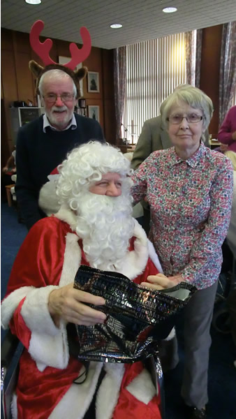 WBro Michael “Rudolph” Robinson with Santa and a Devonshire Court resident