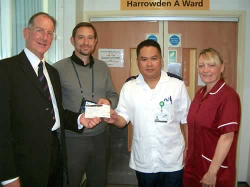(l to r) WBro Norman Pope presenst the cheque to Warc Manager Simon Lee, and Nurses Arnie Aguilar and Jean Addison (l to r) WBro Norman Pope presenst the cheque to Warc Manager Simon Lee, and Nurses Arnie Aguilar and Jean Addison